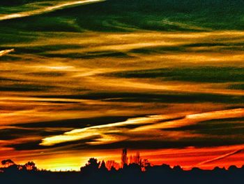 Scenic view of landscape against sky at sunset