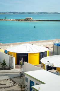 High angle view of swimming pool by sea against sky