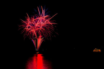 Firework display at night