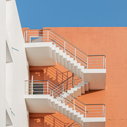 Low angle view of spiral staircase of building against clear sky