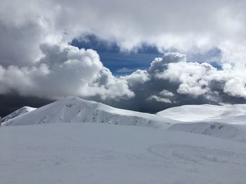 Scenic view of snow landscape against sky