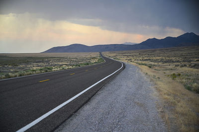 Deserted road in the nevada desert with rain