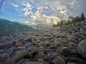 Surface level of beach against sky