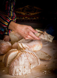 Midsection of man preparing food on table