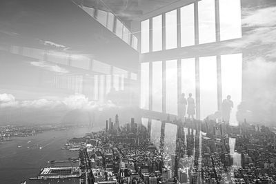 Panoramic view of buildings in city against sky