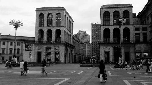 Buildings in city against sky