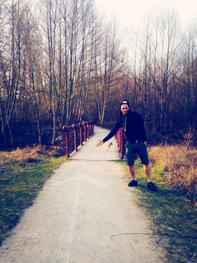 full length, lifestyles, the way forward, rear view, leisure activity, walking, casual clothing, tree, bare tree, men, diminishing perspective, person, transportation, childhood, vanishing point, grass, day, road