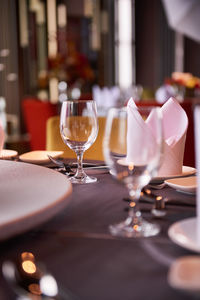 Close-up of wine glasses on table