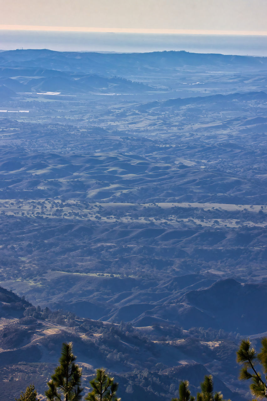 AERIAL VIEW OF CLOUDS OVER LANDSCAPE