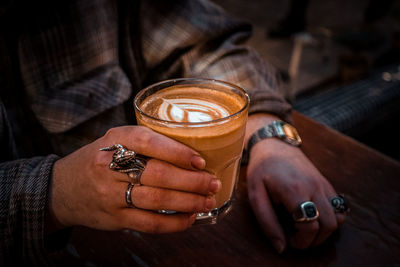 Man holding coffee cup