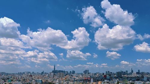 Panoramic view of buildings against blue sky