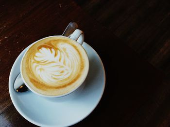 Close-up of coffee cup on table