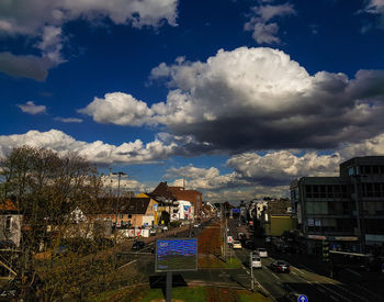 Buildings against cloudy sky