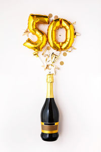Close-up of christmas decorations against white background