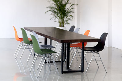 Empty chairs and tables in cafe