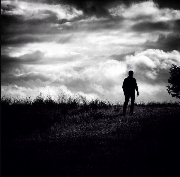 sky, landscape, field, cloud - sky, standing, tranquility, tranquil scene, rear view, grass, full length, cloud, nature, men, scenics, cloudy, beauty in nature, lifestyles, leisure activity