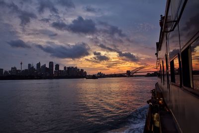 Bridge over river at sunset