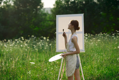 Side view of man standing on field