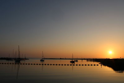 Silhouette of marina at sunset