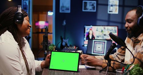 Portrait of man using laptop while sitting in office