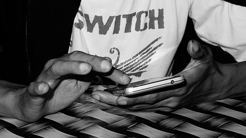 Midsection of man playing with text