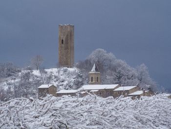 Medieval tower and town under the snow
