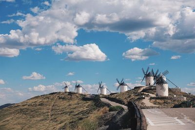 View of traditional windmills against sky