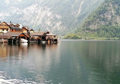 Panoramic view of lake and buildings against sky