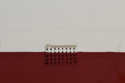 Close-up of white and red wall