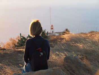 Rear view of woman looking at sea in ponta do pargo