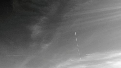 Low angle view of vapor trail against sky