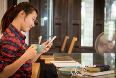 Young woman using mobile phone