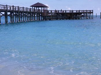 Pier over sea against sky