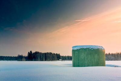Scenic view of frozen lake against sky during winter