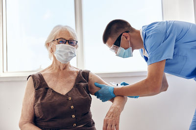 Doctor examining patient at clinic