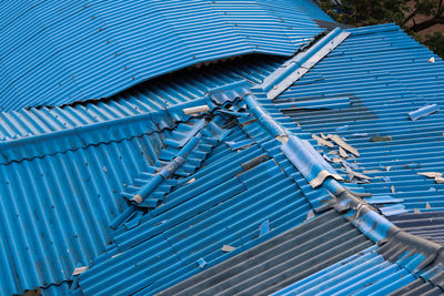 High angle view of metallic roof against blue sky