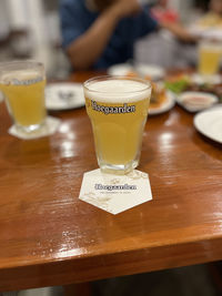 Close-up of beer glass on table