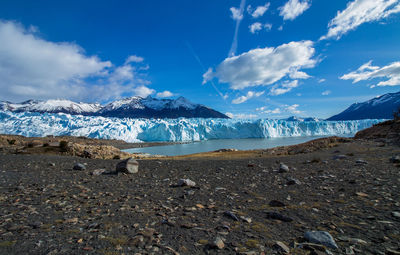 Scenic view of lake against blue sky