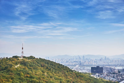 Buildings in city against sky