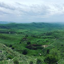 High angle view of green landscape against sky