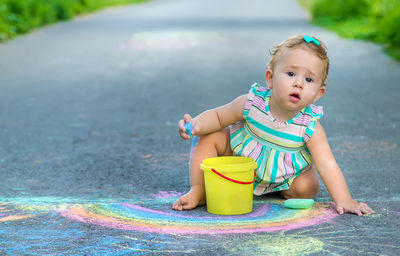 Portrait of cute boy playing in park