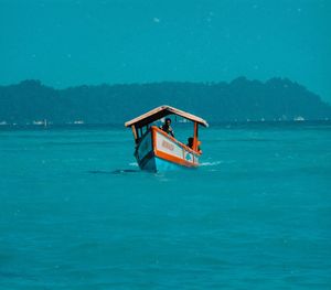 Lifeguard boat in sea against sky
