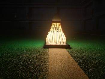 Close-up of illuminated lighting equipment on table