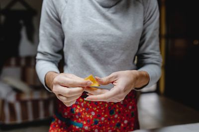 Midsection of woman holding ice cream