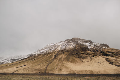 Scenic view of snowcapped mountain against sky