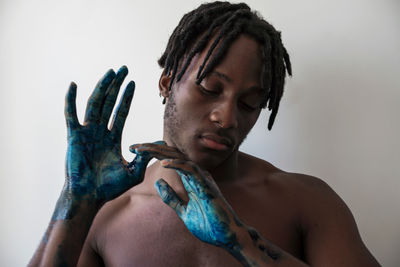 Artistic black man with painted hands