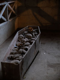 Close-up of abandoned container on wood