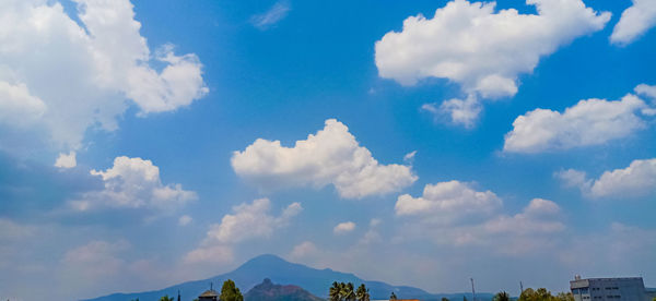 Low angle view of clouds against blue sky