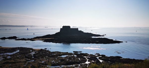 Scenic view of bay against sky