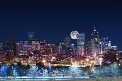 Illuminated buildings in city at night